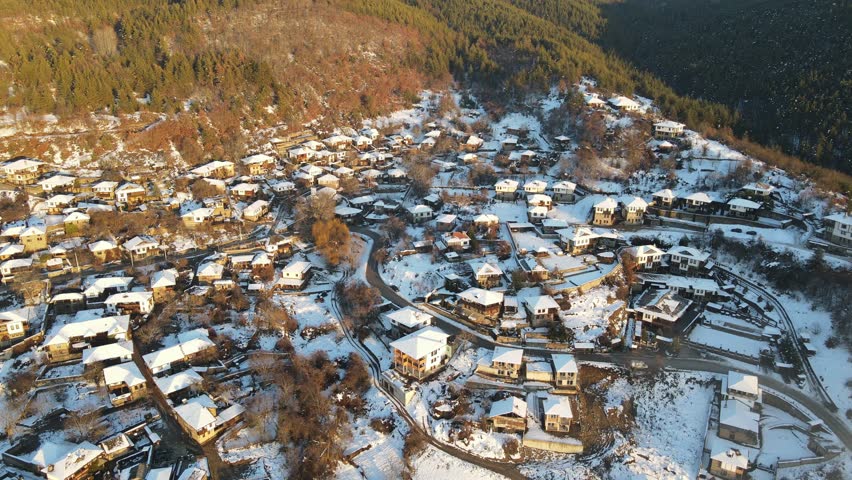 Aerial Winter Sunset view of Village of Leshten with Authentic nineteenth century houses, Blagoevgrad Region, Bulgaria
