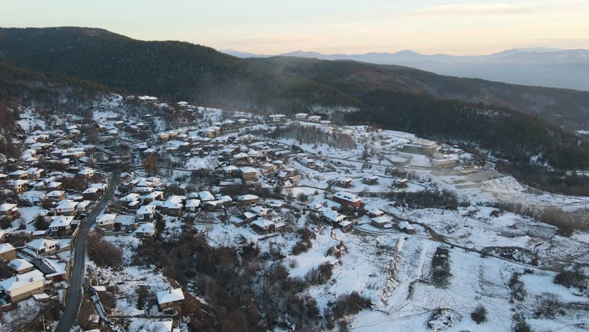 Aerial Winter Sunset view of Village of Leshten with Authentic nineteenth century houses, Blagoevgrad Region, Bulgaria