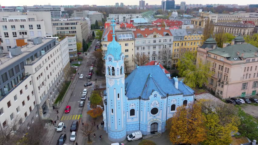 4K cinematic drone footage of the Blue Church in Bratislava, highlighting the building’s distinctive blue colors, decorative mosaics, and curved architectural shapes in the heart of Bratislava._02