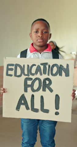 Human rights poster, education and face of child student at school for demonstration or protest. Cardboard sign, change and petition with serious boy in hallway for knowledge, learning or study