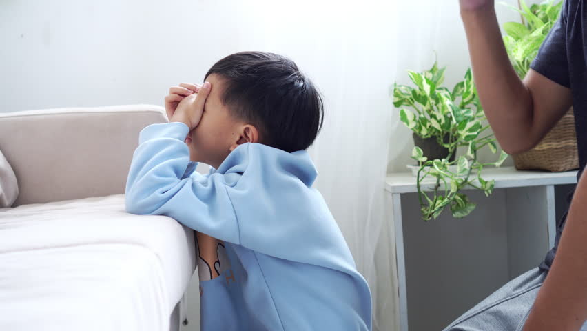 Asian father comforting his crying child that frustration and emotional stress The boys upset and repressed, family tension, emotional challenges, parenting struggles,