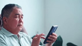 Focused man reviewing documents and using smartphone for business analysis at home - Powered by Shutterstock - Get 15% off with code: PIKWIZARD15