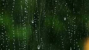 Raindrops running down a window pane, capturing serene rainy weather, reflective mood, and natural water motion. - Powered by Shutterstock - Get 15% off with code: PIKWIZARD15
