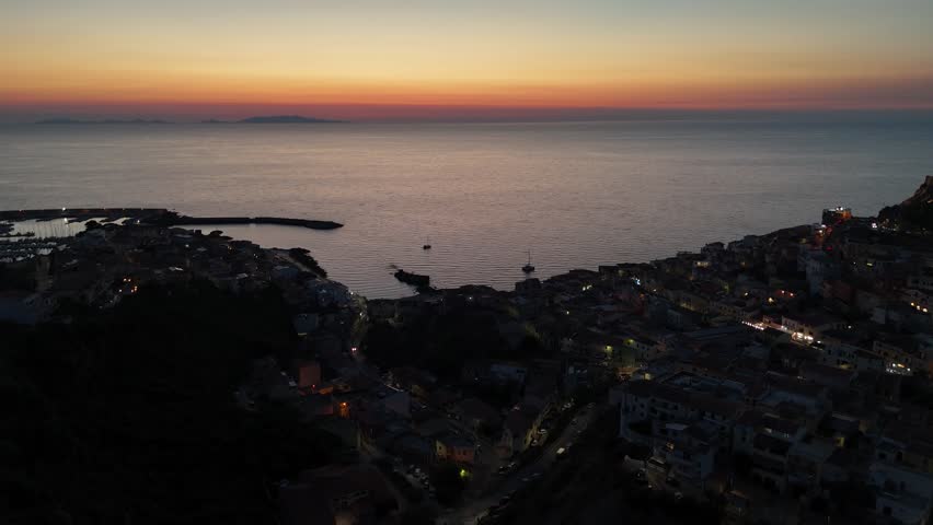 Sunset over Castelsardo, Sardinia. Tranquil coastal town at dusk
