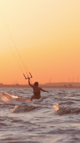 mastery kitesurfing slow motion silhouette professional tricks and jumps orange sunset extreme sports