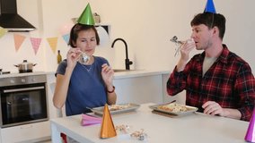 Couple celebrating birthday at home, Couple enjoying cozy wine dinner together at modern white kitchen and dinning room. cozy vibes . Evening full of love, connection, and calm conversation. - Powered by Shutterstock - Get 15% off with code: PIKWIZARD15