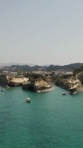 Aerial view of the Channel of Love, known as Canal D’Amour, in Sidari, Corfu, showcasing unique sandstone formations and turquoise waters.