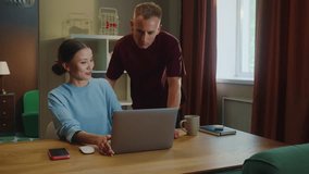 Boss man checks asian woman subordinate do task correctly report. Management satisfied work. Employee right answer. Good job. Guy show laptop screen. Multi racial national couple online shopping home. - Powered by Shutterstock - Get 15% off with code: PIKWIZARD15