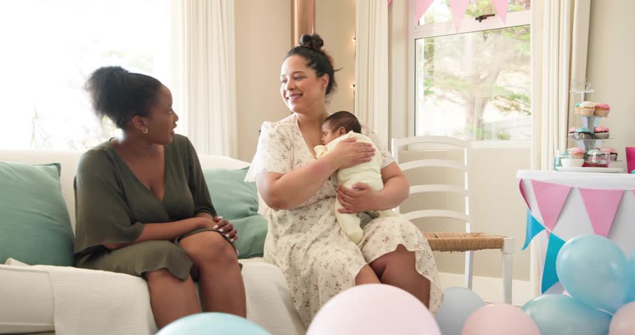 Women clapping on pregnant reveal honoring health with floating chat icons overlaying group. Babyshower, pastel, balloons, bunting, infants, decor, celebration