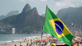 Slow motion shot of the Brazilian flag waving in the wind on Ipanema Beach in Rio de Janeiro, Brazil. - Powered by Shutterstock - Get 15% off with code: PIKWIZARD15