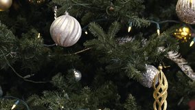 Christmas tree ornament with warm festive lights creating cozy holiday mood - Powered by Shutterstock - Get 15% off with code: PIKWIZARD15