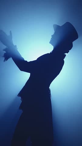 silhouette gentleman standing ovation, clapping hands bravo gesture, delighted applause in dark night stage, person in top hat tailcoat frock coat suit, black classic bowler hat 1800s. vertical video