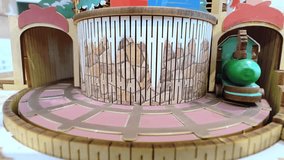 A Christmas toy train riding on rails around a Christmas tree. New Year's mood. Christmas background. - Powered by Shutterstock - Get 15% off with code: PIKWIZARD15