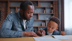 African American family father with son studying control study process concentrated domestic education kid boy child writing homework with caring dad parent private teacher at home learning childcare  - Powered by Shutterstock - Get 15% off with code: PIKWIZARD15