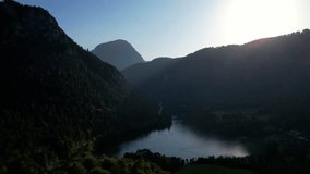 4K Aerial Drone video of Alpine lake Thumsee with turquoise water and lush green woods surrounded by tall mountains at sunset golden hour in Bad Reichenhall Germany - Powered by Shutterstock - Get 15% off with code: PIKWIZARD15