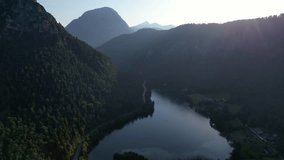 4K Aerial Drone video of Alpine lake Thumsee with turquoise water and lush green woods surrounded by tall mountains at sunset golden hour in Bad Reichenhall Germany - Powered by Shutterstock - Get 15% off with code: PIKWIZARD15