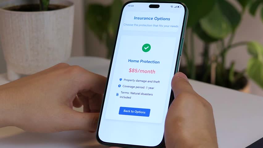 Close-up of a mans hands carefully studying the specific terms and premium of a home insurance policy on a mobile device. This clip represents the crucial evaluation phase before protecting ones