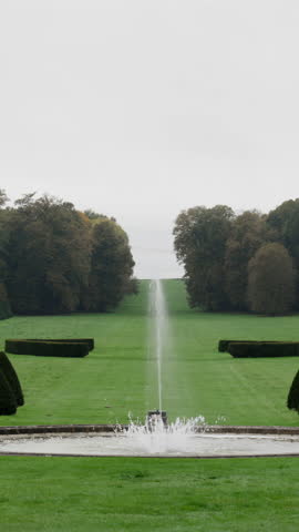 balanced garden scene, classical landscape arrangement with reflective water features and greenery
