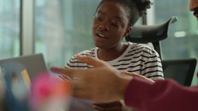 Informal startup project details business group of diversity workers with documents laptop at workplace modern office three multiethnic people communicating presenting ideas planning strategic session - Powered by Shutterstock - Get 15% off with code: PIKWIZARD15