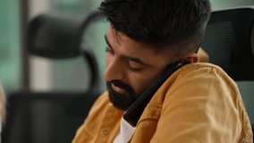 Talking Indian businessman manager talk calling client Arabian male Hindu guy informal business man mobile phone conversation talking smartphone in workplace discuss document team office at meeting - Powered by Shutterstock - Get 15% off with code: PIKWIZARD15