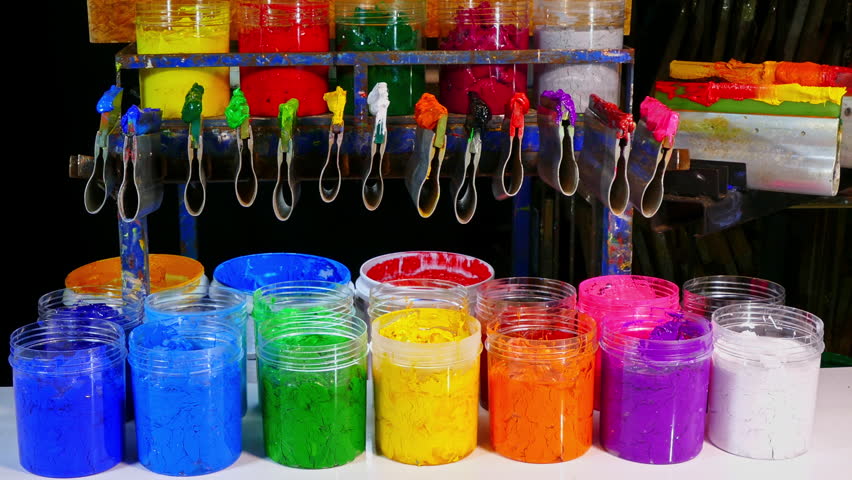 Colorful Ink for Screen Printing Factories
Inside a busy Tee shirt factory plastisol inks in multiple tones bright and dark are neatly arranged for industrial use. Workers use handmade tools handles