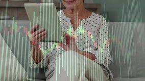 Senior woman tapping and swiping tablet on sofa, generating market overlay, smiling into laughter. Elderly, livingroom, device, charts, finance, lifestyle, cozy - Powered by Shutterstock - Get 15% off with code: PIKWIZARD15