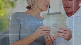 Mature man and woman tapping tablet, shifting grip, scanning animated HUD, discovering tech insight. Couple, seniors, device, garden, sunlight, bokeh, collaboration - Powered by Shutterstock - Get 15% off with code: PIKWIZARD15