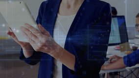 Standing woman tapping white tablet and causing blue digital tech overlay while reviewing content. Office, collaboration, teamwork, productivity, modern, monitors, openplan - Powered by Shutterstock - Get 15% off with code: PIKWIZARD15