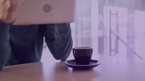 Adult male tapping tablet near coffee cup, updating business bar charts, grid filling left to right. Cafe, remote, freelancer, analytics, visualization, data, daylight - Powered by Shutterstock - Get 15% off with code: PIKWIZARD15