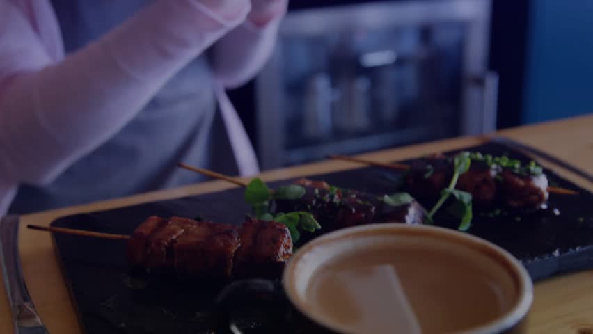 Cafe customer gesturing, initiating HUD, lifting tablet, scanning plate for nutrition. Holographic, overlay, interface, data, analytics, futuristic, device - Powered by Shutterstock - Get 15% off with code: PIKWIZARD15