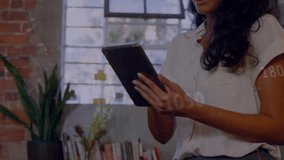 Businesswoman tapping tablet, causing finance graphs sweeping across window while analyzing data. Office, analytics, charts, reading, focus, modern, workspace - Powered by Shutterstock - Get 15% off with code: PIKWIZARD15