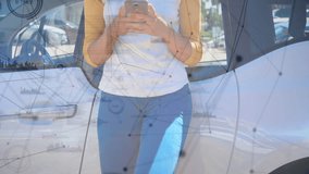 Woman tapping smartphone in parking lot reading message and causing tech network overlay smiling. Mobile, scrolling, casual, urban, outdoor, modern, connectivity - Powered by Shutterstock - Get 15% off with code: PIKWIZARD15