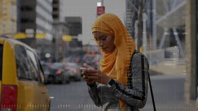 Woman holding smartphone and tapping, starting tech HUD while preparing to cross and checking watch. Pedestrian, outdoor, urban, sidewalk, traffic, cityscape, overlay - Powered by Shutterstock - Get 15% off with code: PIKWIZARD15