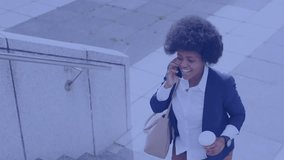 Executive answering business call while climbing stairs with coffee HUD overlaying map showing data. Woman, blazer, smartphone, cup, commute, digital, corporate - Powered by Shutterstock - Get 15% off with code: PIKWIZARD15