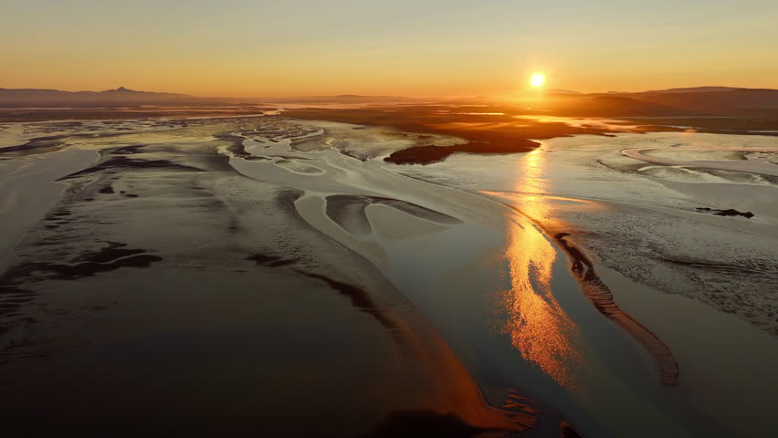 Sunrise Over the Icelandic Coastline Golden Light on Rugged Seashore