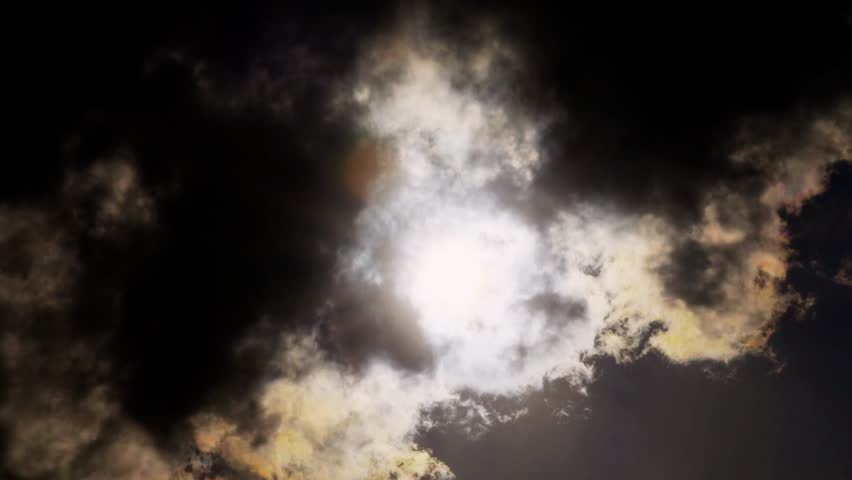 Time-lapse of the sun breaking through stormy clouds, creating dramatic light rays. Perfect for weather, nature, atmospheric visuals, and cinematic time-lapse photography.