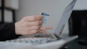 Close-up of female hands entering credit card data to make a purchase, illustrating online payments, digital transactions, and secure financial activity. - Powered by Shutterstock - Get 15% off with code: PIKWIZARD15