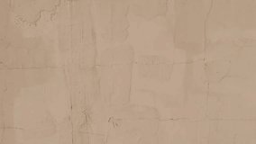 A textured beige wall background with subtle cracks and imperfections - Powered by Shutterstock - Get 15% off with code: PIKWIZARD15