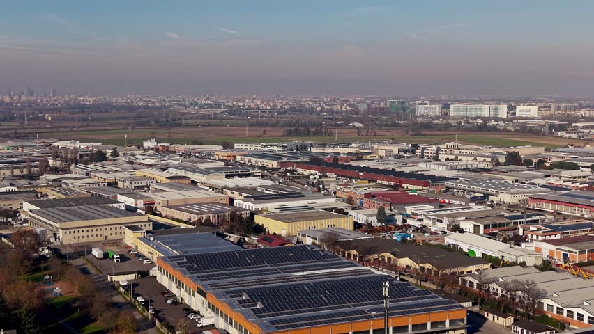 Drone panorama of industrial warehouses. Manufacturing area, Production zone, industrial district in Sesto Ulteriano, Lombardy, Italy