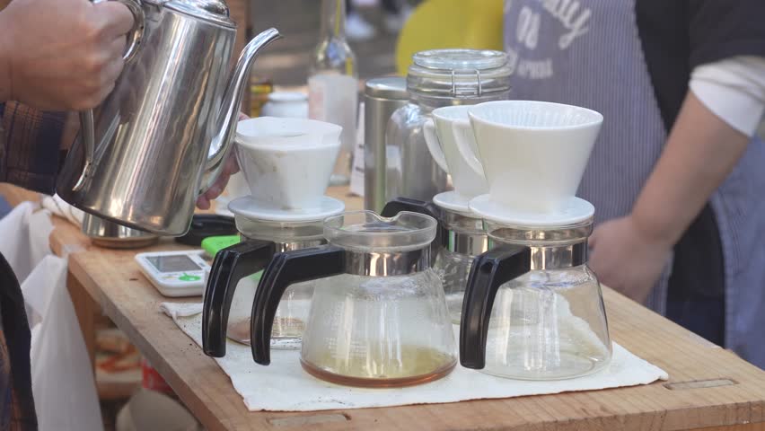 Image of a man making coffee