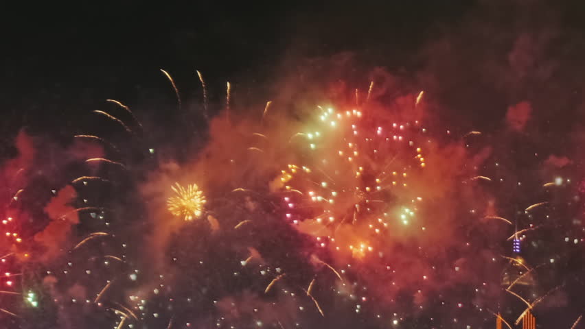 Bright fireworks exploding in night sky. Festive celebration light show. Holiday event display