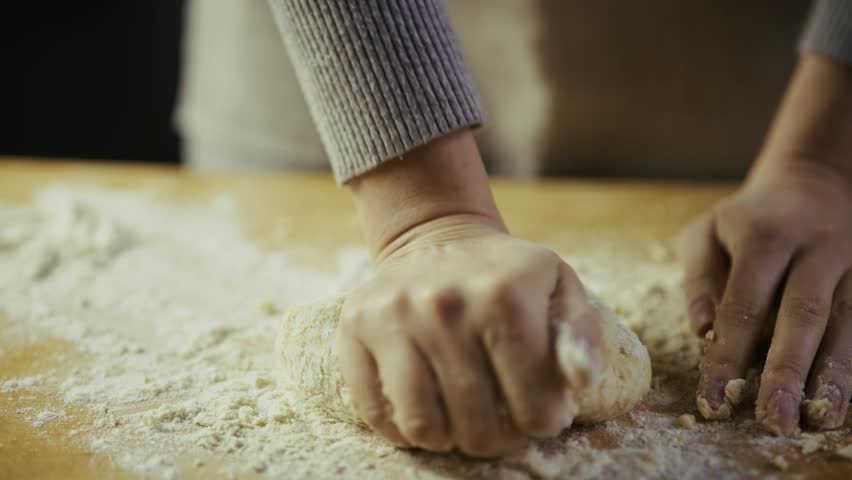 Chef Preparing Bread Or Pasta Dough. Bread Making Process Gourmet Recipe. Dusting Flour On Raw Dough. Baking Ingredient Making Homemade Food. Home Cooking Fresh Dough Texture. Domestic Cooking Dough