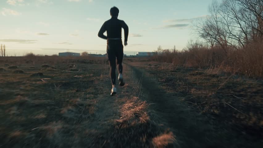 Sporty Man Running. Runner Jogging Physical Wellness Routine. Endurance Workout Trail Running. Cardio Training Morning Run. Fitness Exercise Outdoors Afternoon Fitness.Athlete Training Running Workout