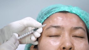 Doctor Injecting Botox on Forehead – Aesthetic Treatment, Beauty Clinic, Anti-Aging Procedure 4K Footage - Powered by Shutterstock - Get 15% off with code: PIKWIZARD15