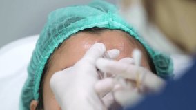 Doctor Injecting Botox on Forehead – Aesthetic Treatment, Beauty Clinic, Anti-Aging Procedure 4K Footage - Powered by Shutterstock - Get 15% off with code: PIKWIZARD15