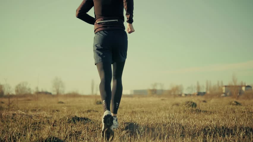 Sporty Man Running. Runner Jogging Physical Wellness Routine. Endurance Workout Trail Running. Cardio Training Morning Run. Fitness Exercise Outdoors Afternoon Fitness.Athlete Training Running Workout