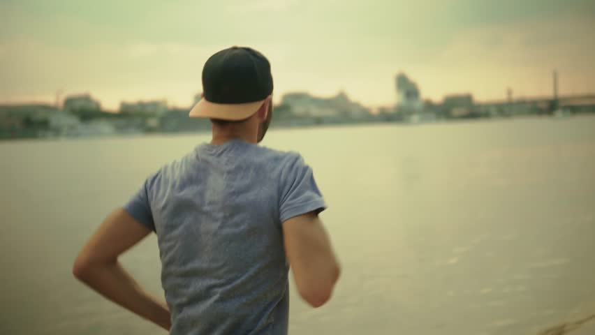 Sporty Man Running. Runner Jogging Physical Wellness Routine. Endurance Workout Trail Running. Cardio Training Morning Run. Fitness Exercise Outdoors Afternoon Fitness.Athlete Training Running Workout