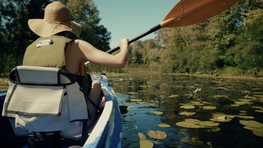 Kayaker Paddling Down Green River In Summer. Oar Blade In Water, Outdoor Water Sports Adventure, Recreational Canoeing And Exploration. Watercraft Sport Peaceful Summer Vacation Adventure Tourism