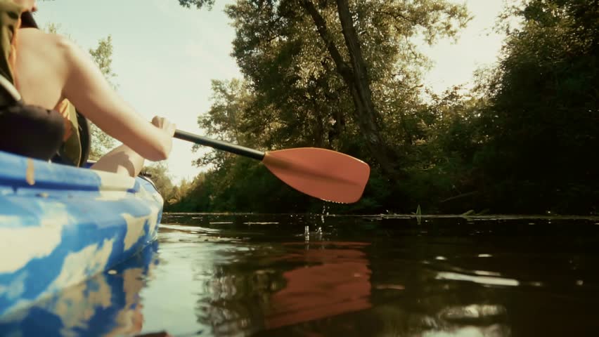 Kayaker Paddling Down Green River In Summer. Oar Blade In Water, Outdoor Water Sports Adventure, Recreational Canoeing And Exploration. Watercraft Sport Peaceful Summer Vacation Adventure Tourism