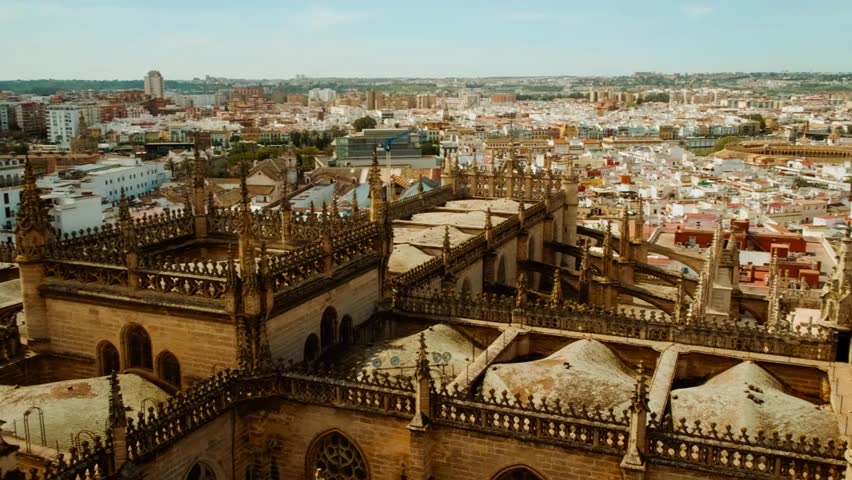 A panoramic elevated view of a historic city blending old quarter charm with modern architecture, highlighting landmarks, rooftops, and a dynamic urban landscape.